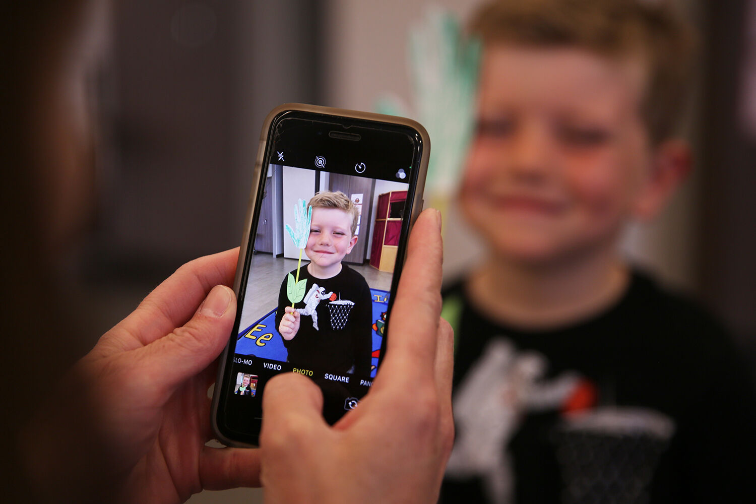 Benson Farris, 4, smiles with his flower